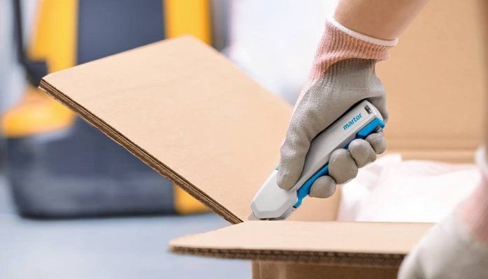 Trigger versus slider style safety knives
